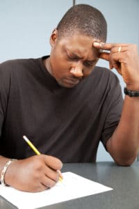 An image of a man concentrating while studying
