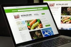 image of a laptop open to the groupon homepage acupuncture clinic marketing